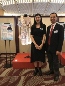 Dr. Kim Mak (President) and student Emma Lei in front of Emma’s designed clothes at the Fashion Showcase.